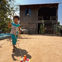 Village Girl and Her Toy